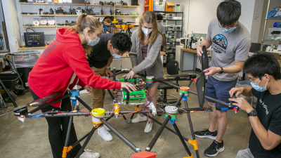 students work on a drone in the Foundry