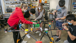 students work on a drone in the Foundry