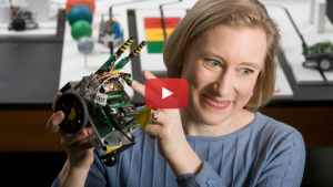 Faculty member Lisa Huettel with robot