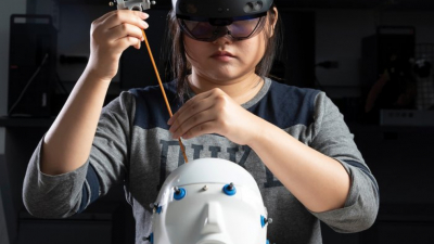 A Duke University student uses an enhanced-reality tool for brain surgery