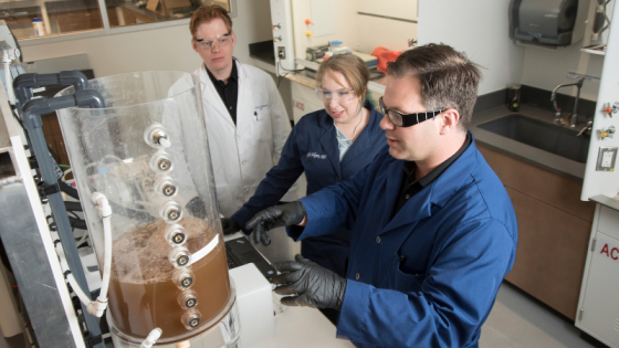 Researchers Brian Hawkins, Katelyn Sellgren and James Thostenson work together at the Center for WaSH-AID.