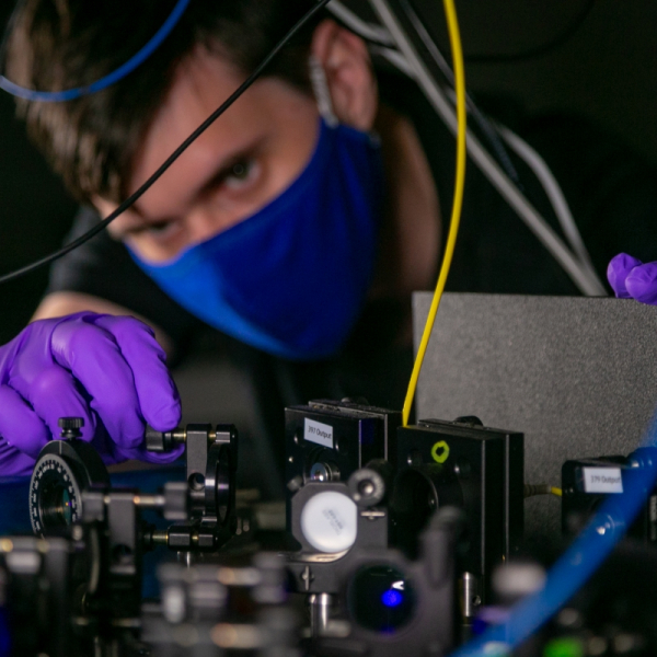 Eric Pretzsch works on a quantum computer setup in the Brown Lab