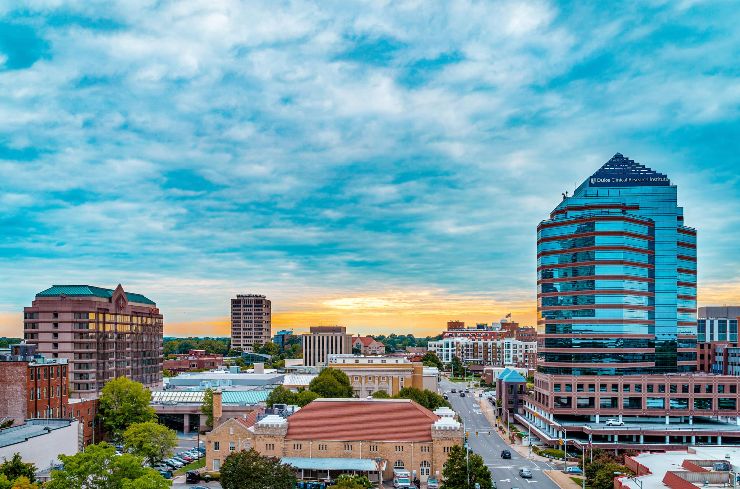 downtown Durham skyline during a heavily clouded sunset