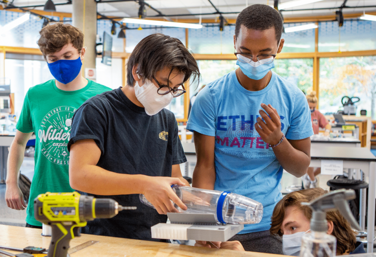 The students engineering a mechanical opening device for a pneumatic tube carrier for Duke University Hospital