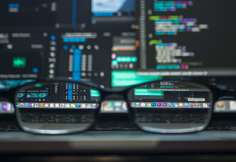 Glasses sitting on a laptop keyboard