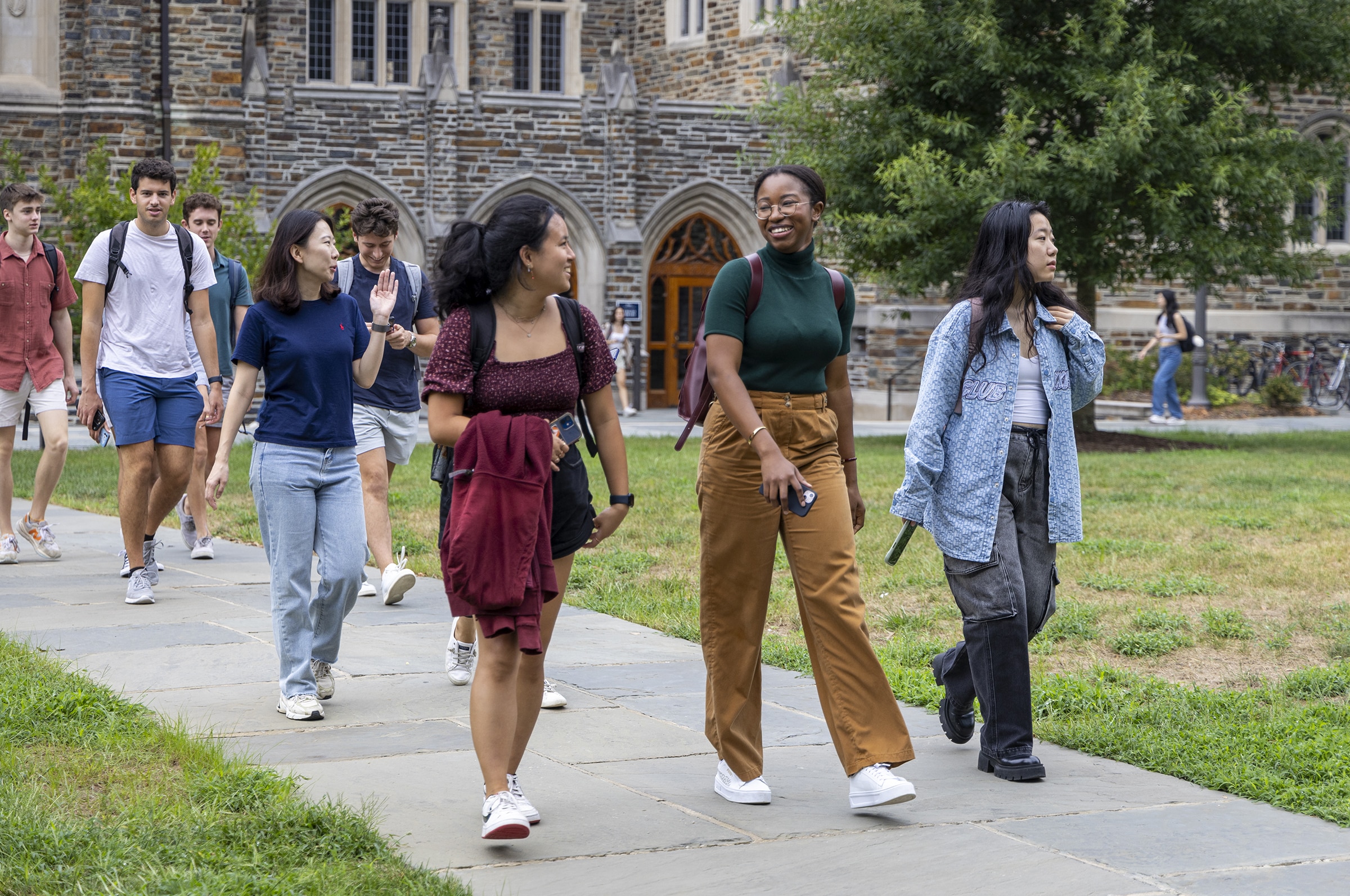 Students walk across a university campus