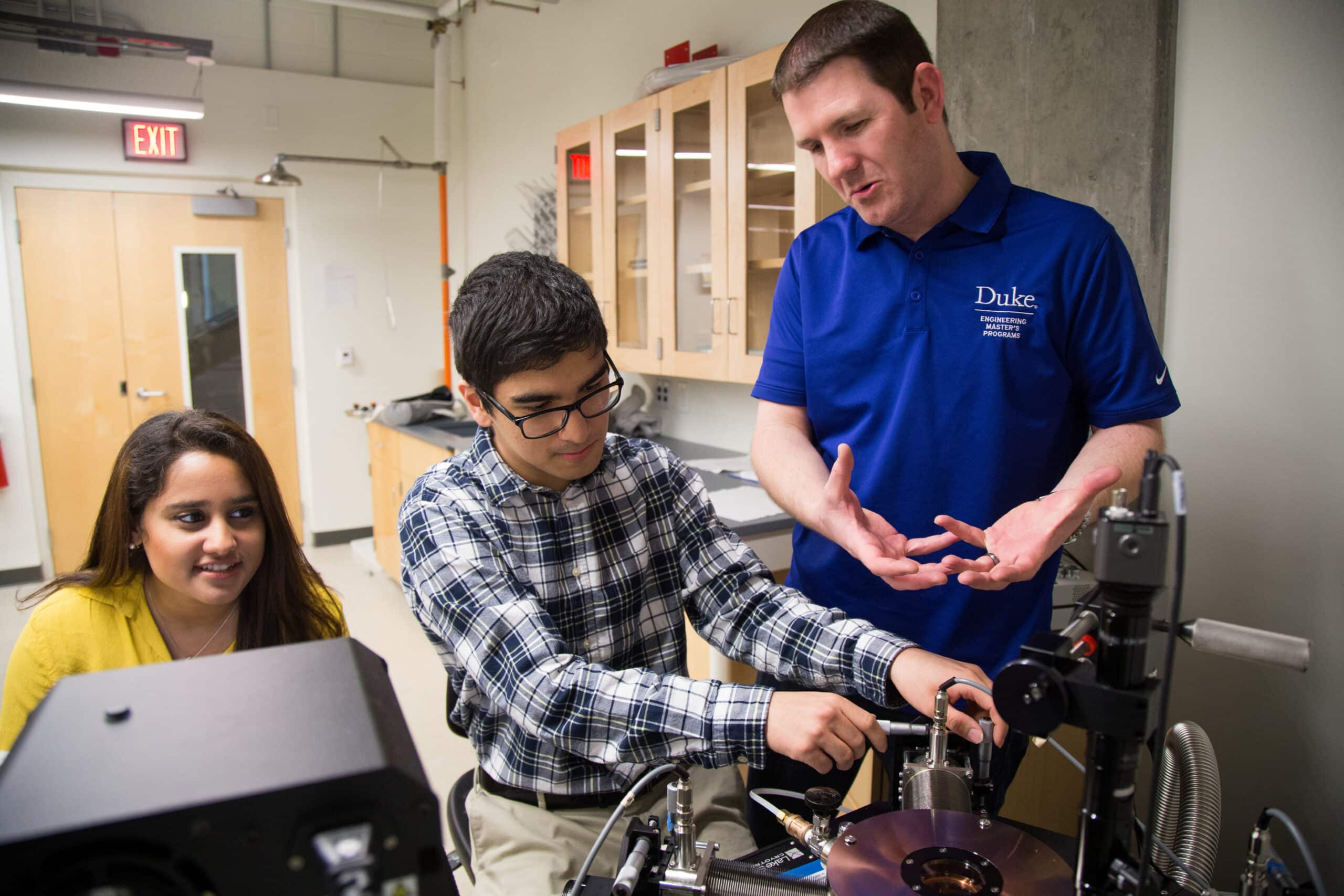 students work with Professor Aaron Franklin on a tire sensor