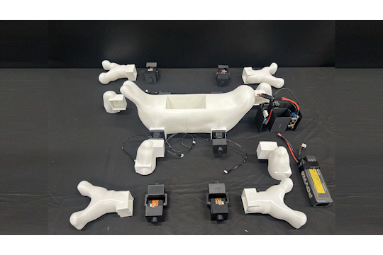 plastic and electronic parts assemble into a walking robot