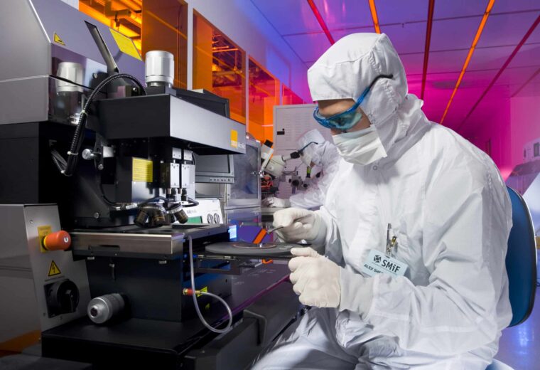 SMIF researcher working with a microscope