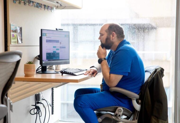 Dr. Matthew Luedke, a neurologist at Duke, uses 2HELPS2B, an AI tool used in hospitals to quickly predict the likelihood of a person having a seizure.