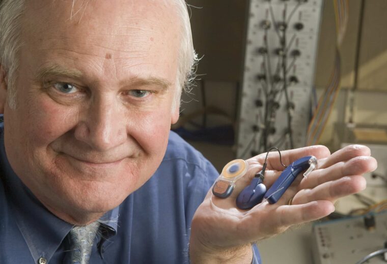Blake wilson holding a cochlear implant